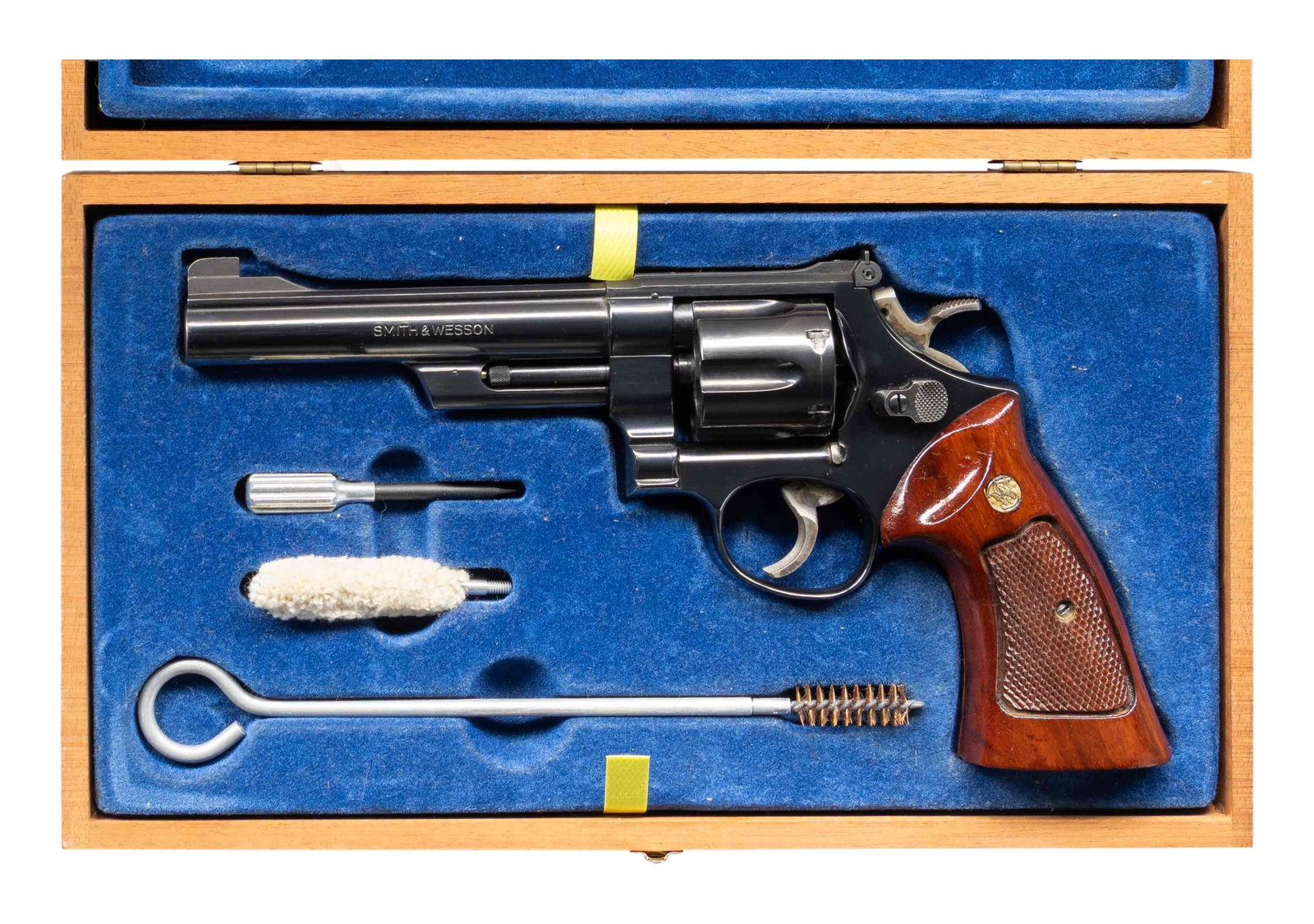 SMITH & WESSON MODEL 25-2 DA REVOLVER.: Cal. 45 ACP. S# N845698. Bbl. 6" pinned. Patridge front sight. Adjustable square notch rear sight. Early 1980's made 25-2 revolver. Blued finish with case colored target hammer & trigger. Checkered ha