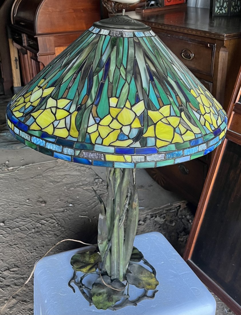 Ornate Bronze base Pond Lily Lamp with slag glass shade: Size 30” H x 20” across shade lengthShade no breaks or cracks sits FlatMetal I’m not sure could be bronze base or copper leaves
