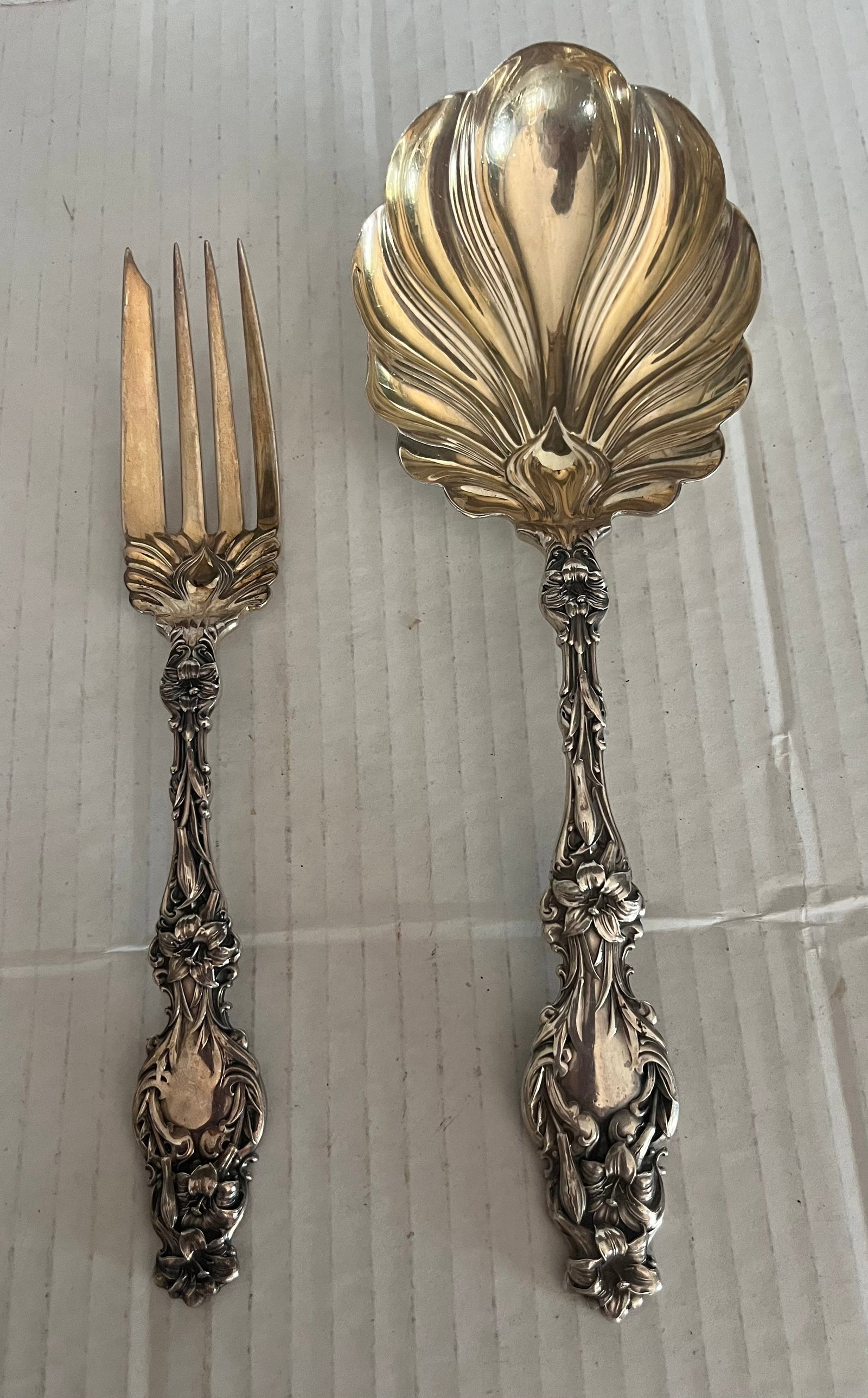 Sterling Pr. Of Orate Serving Pieces: signed , needs a little polishing, Excellent conditionSize spoon 9” Fork7”Weight 196.4 grams