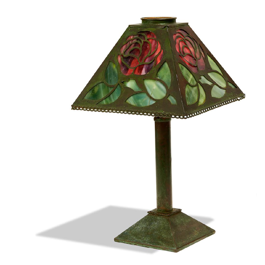 Riviere Studios desk lamp: Riviere Studios desk lamp New York, New York stained and leaded glass, bronzed metal unmarked 7 5/8"sq x 13 1/2"h Provenance: Property from the Collection of Dr. Leslie and Sydelle Sher, Delray Beach,