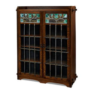 Limbert early Floral two-door bookcase, #331: Charles P. Limbert Furniture Co. early Floral two-door bookcase, #331 Grand Rapids, Michigan oak, iron, leaded glass unsigned 44"w x 15"d x 54"h