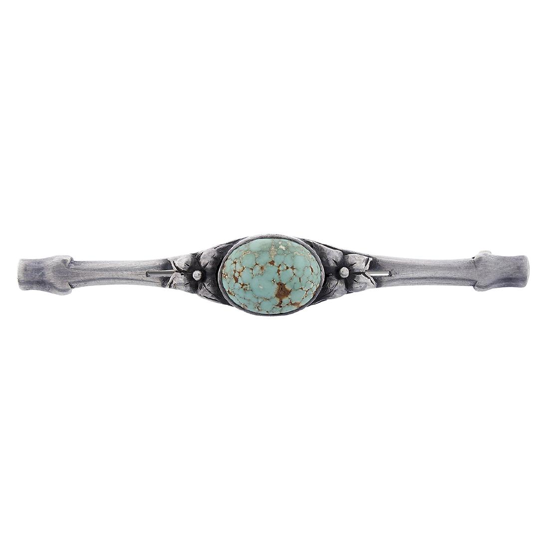 The Kalo Shop bar pin / brooch with turquoise: The Kalo Shop bar pin / brooch Chicago, Illinois sterling silver, turquoise stamped marks inset oval cabochon stone flanked by applied flowers 2 1/2"w x 5/16"h Provenance: The Paul & Terry Somerson Co