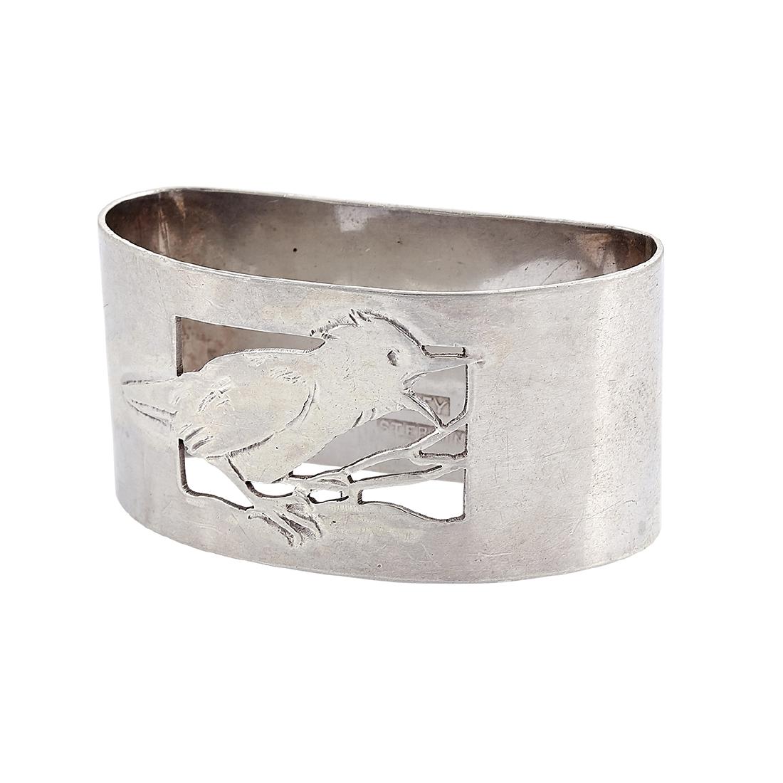 Rokesley Shop baby bird child's napkin ring: The Rokesley Shop child's napkin ring with pierced and chased baby bird decoration Cleveland, Ohio sterling silver stamped marks engraved C.G.B. 1917 2"w x 15/16"d x 1"h Provenance: The Paul & Terry S