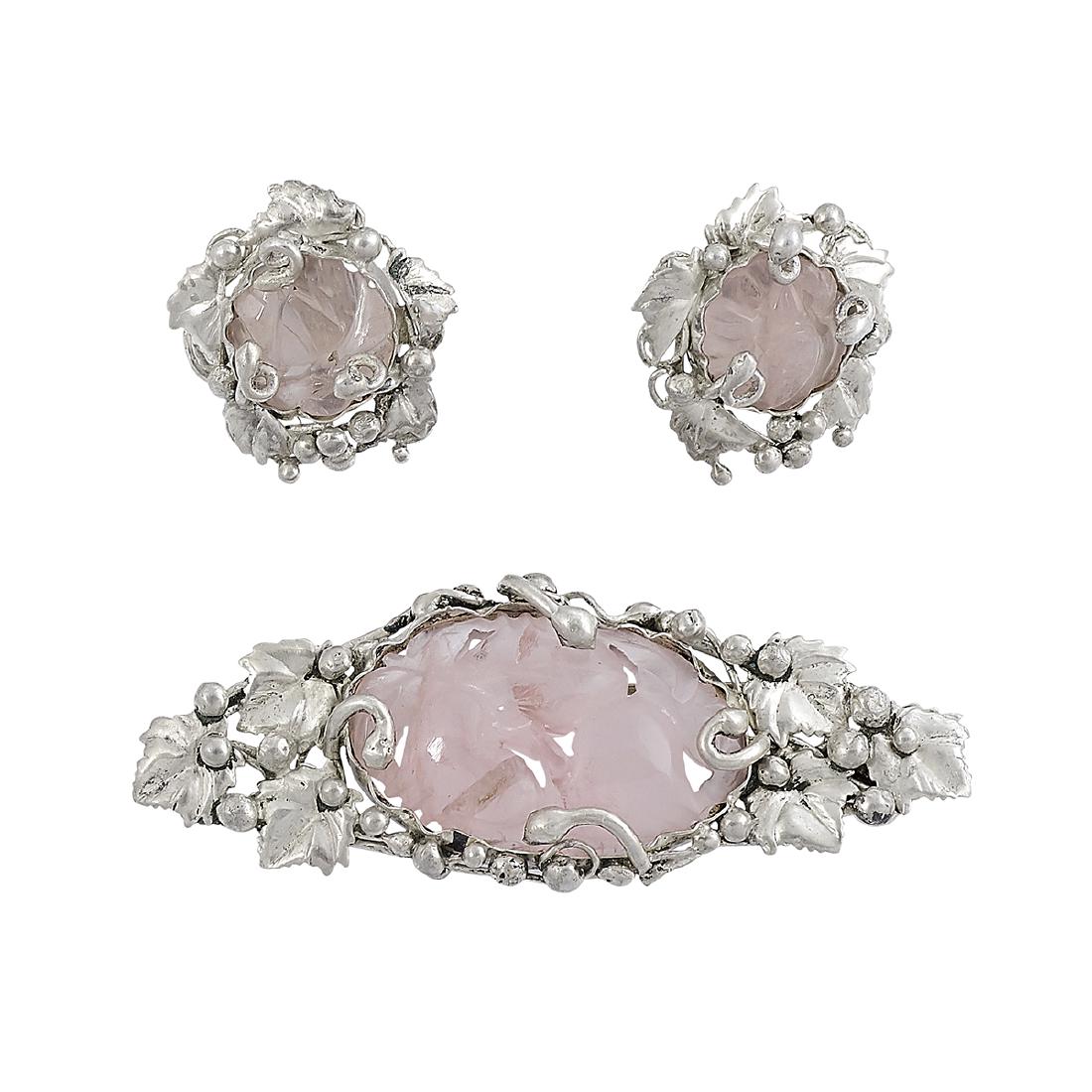 Mary Gage brooch and earrings with pink quartz: Mary Gage (1898-1993) ladies demi-parure: brooch and screwback earrings New York, New York sterling silver, pink quartz stamped marks leaf and berry decoration centered by carved foliate stones brooch