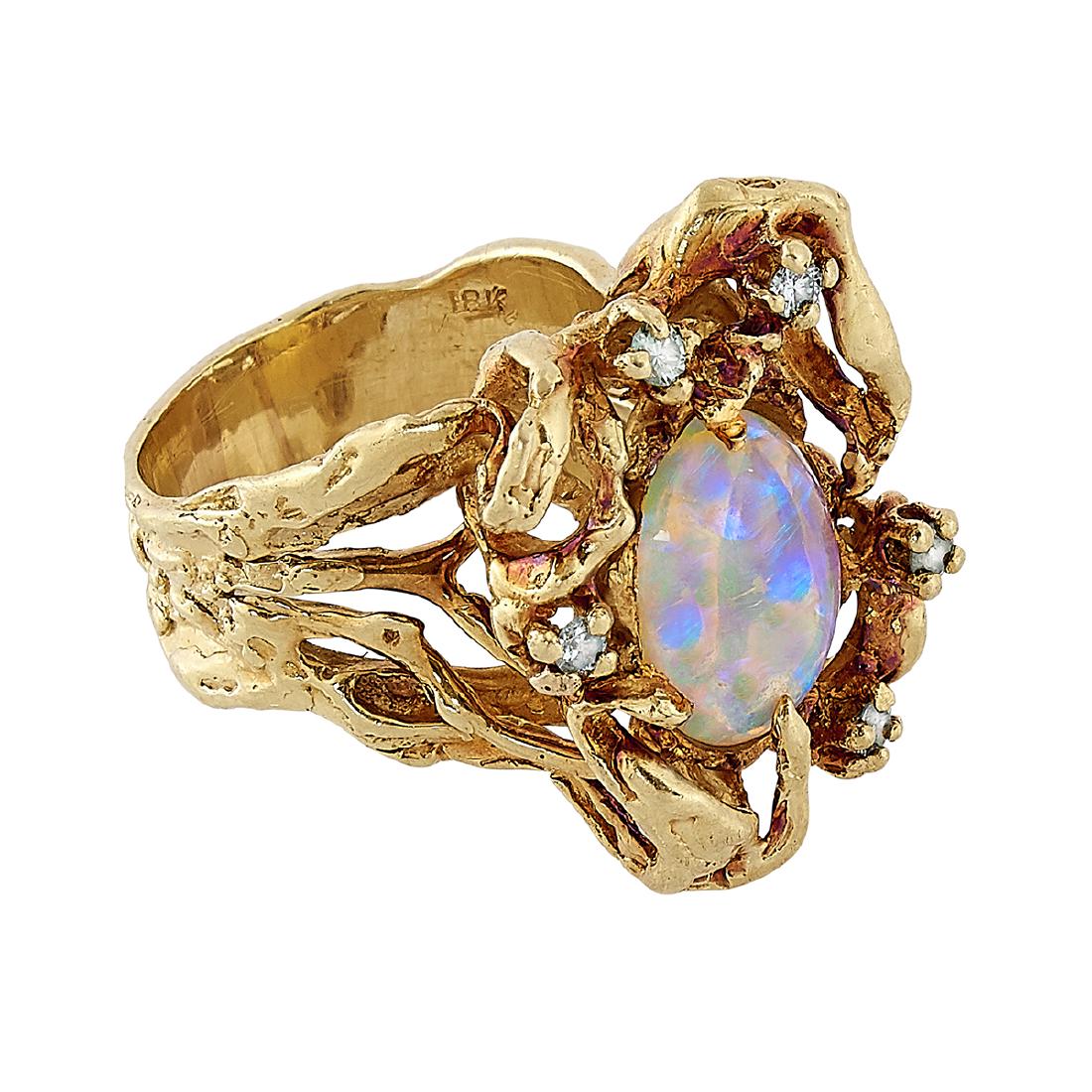 Arthur King 18K gold, opal and diamond ring: Arthur King (1921-1986) ladies ring New York, New York 18K yellow gold, opal, diamonds stamped marks 11.5 dwts size: 8 1/2; face: 15/16"w x 11/16"h Provenance: The Paul & Terry Somerson Collection of