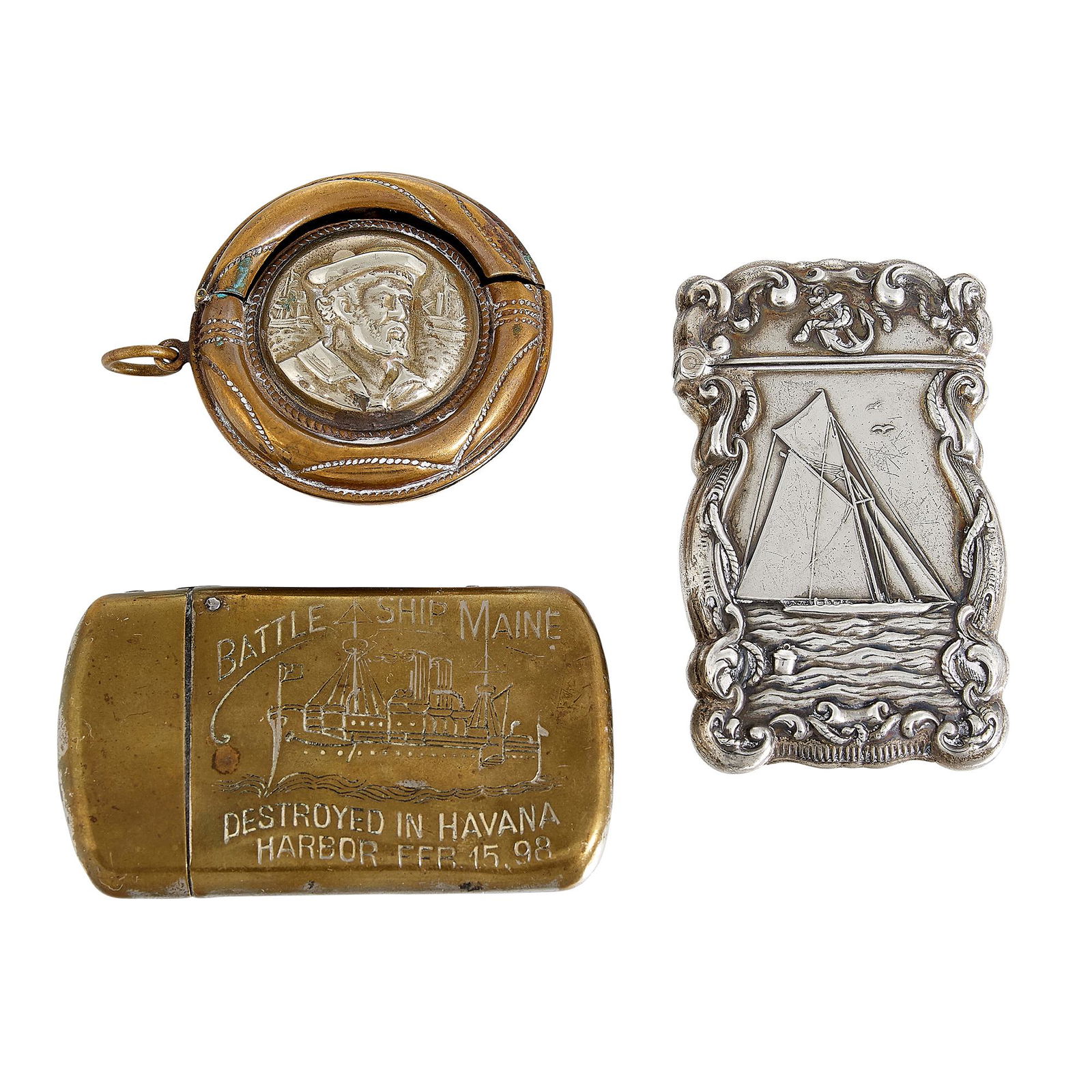 Nautical Themed match safes / vestas, three: Nautical Themed match safes / vestas, group of three: 1) yacht at sail, in sterling 2) Battle Ship Maine, Destroyed in Havana Harbor, Feb 15, 98, in brass 3) sailor in a lifesaver, in brass and silver