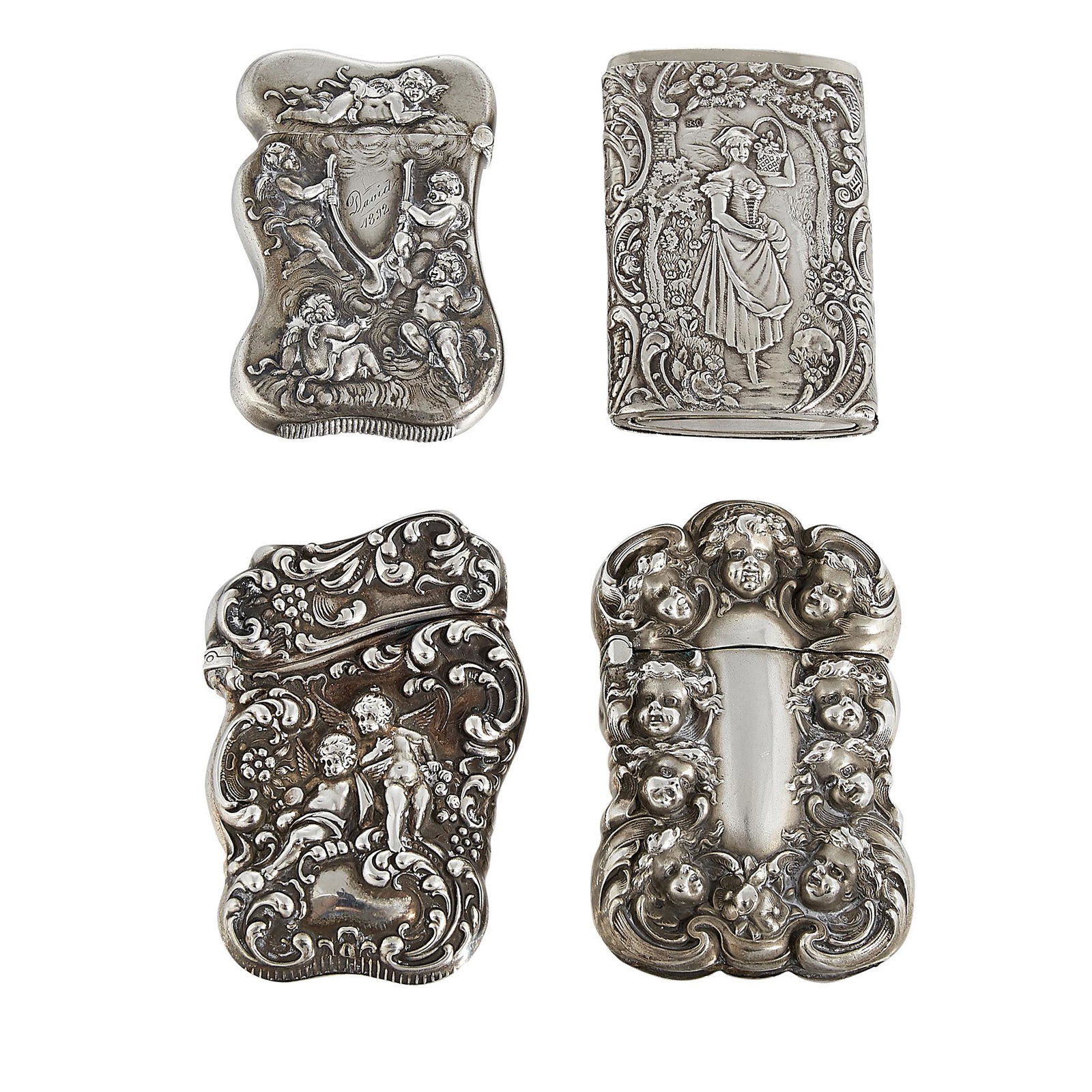 Classical Motifs match safes / vestas, four: Classical Motifs match safes / vestas, group of four: 1) double-sided putti heads, in sterling silver by Unger Brothers 2) single-sided Rococo and two winged putti, in sterling silver by Unger Brother