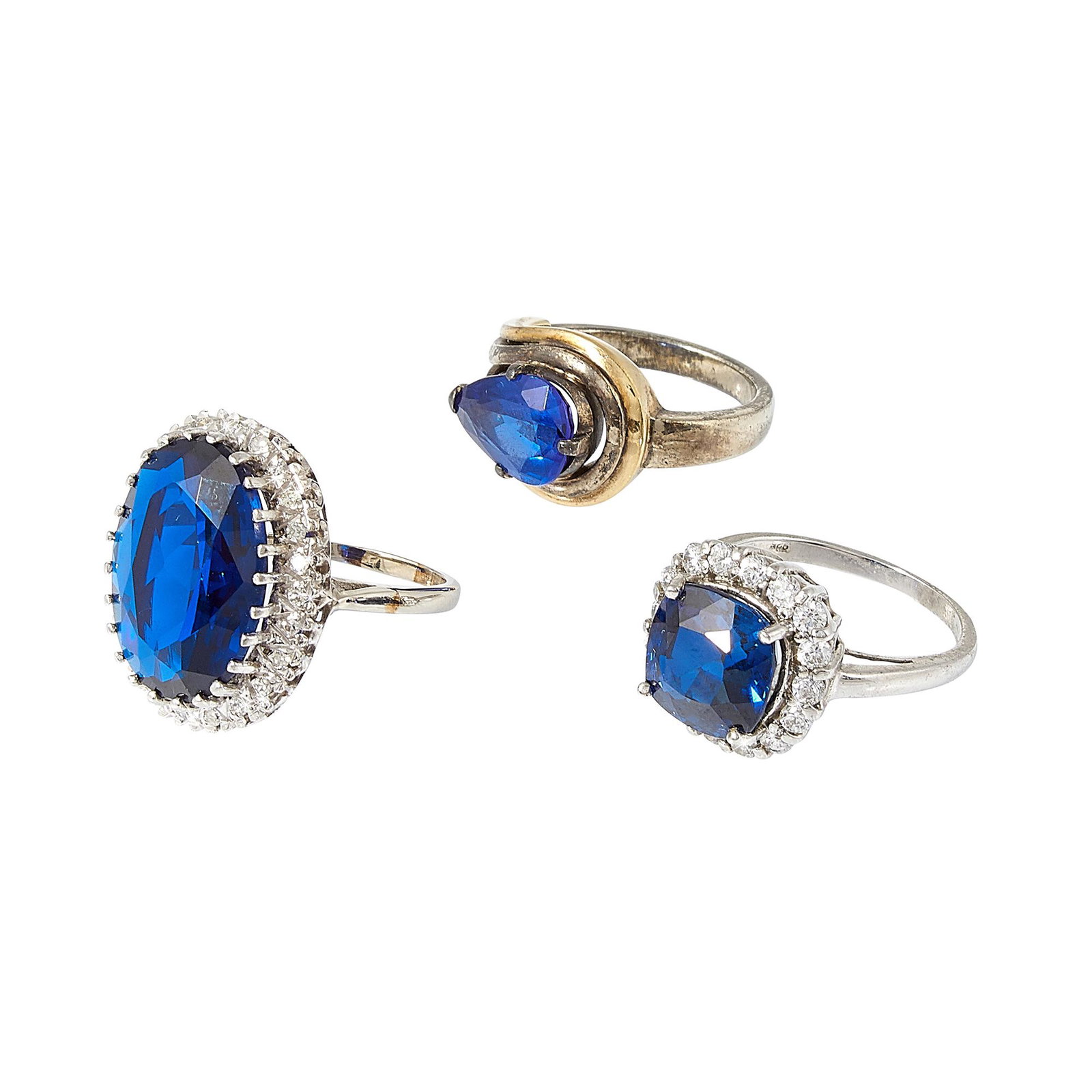 Jewelry Group ladies rings, three: Jewelry Group ladies rings, three: 1) 14K white gold, oval cut synthetic spinel, .25 cttw diamonds (clarity: SI1-I1, color: H-L), marked, size 6 3/4 2) 14K white gold, cushion cut synthetic sapphire, 