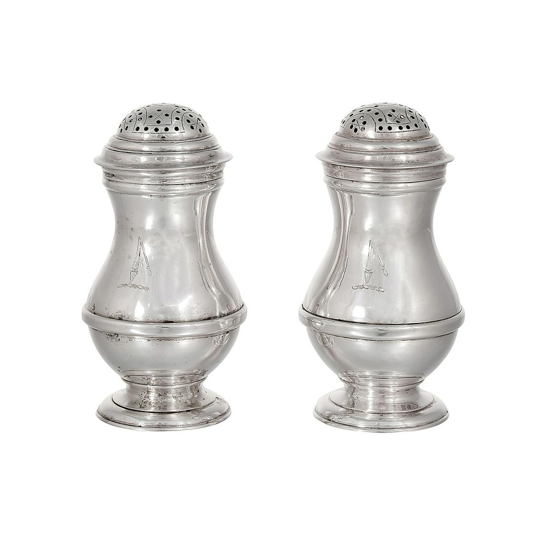 The Kalo Shop casters, #OE2, pair: The Kalo Shop casters, #OE2, pair Chicago, Illinois sterling silver stamped marks each with engraved crests depicting broken spears 1 7/8"dia x 3 1/2"h
