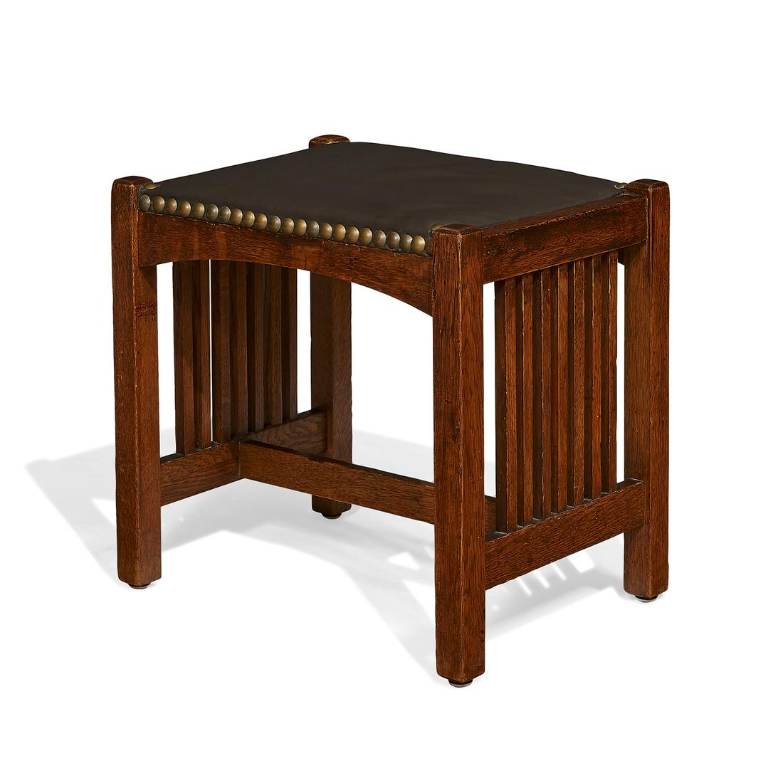 L. & J. G. Stickley spindle footstool, #1292: L. & J.G. Stickley spindle footstool, #1292 Fayetteville, New York oak, leather, brass marked with Handcraft decal 18"w x 13"d x 16"h