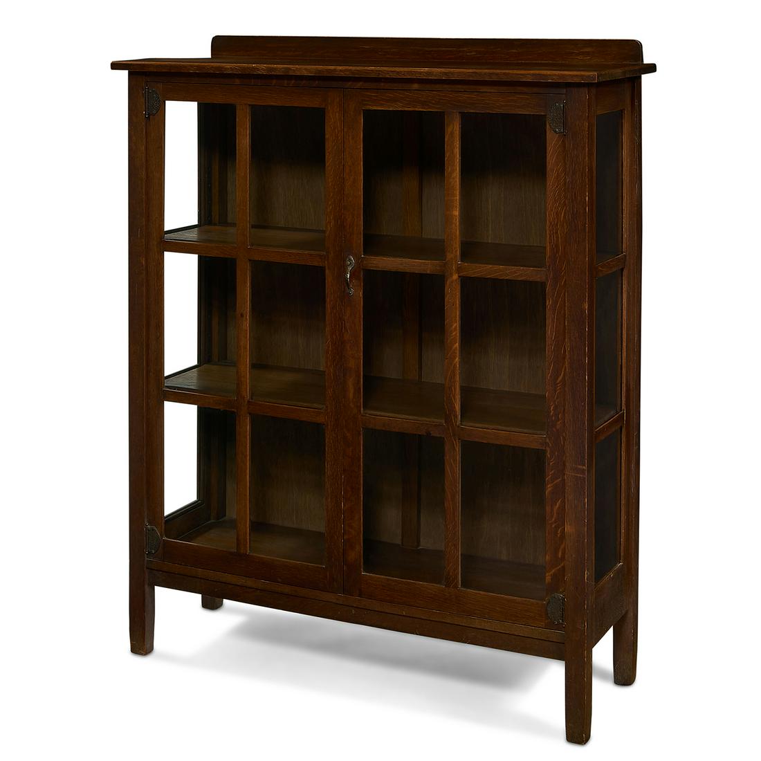 Stickley Brothers china cabinet, #8448: Stickley Brothers china cabinet, #8448 Grand Rapids, Michigan oak, glass, copper Quaint metal tag 43"w x 15 1/2"d x 53 1/2"h Provenance: The Collection of Vera Parry and Judith Parry Gregorio, Buffalo