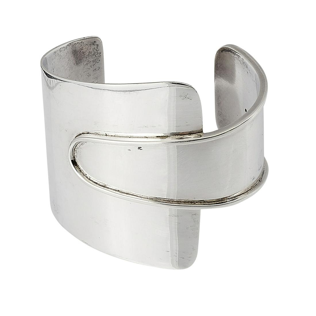Ed Wiener cuff bracelet: Ed Wiener (1918-1991) cuff bracelet New York, New York sterling silver stamped marks 37.9 dwts widest point of the bangle: 2 1/4"w, opening: 1 1/4"w, inside: 2 3/8"w x 2"d (approximately)