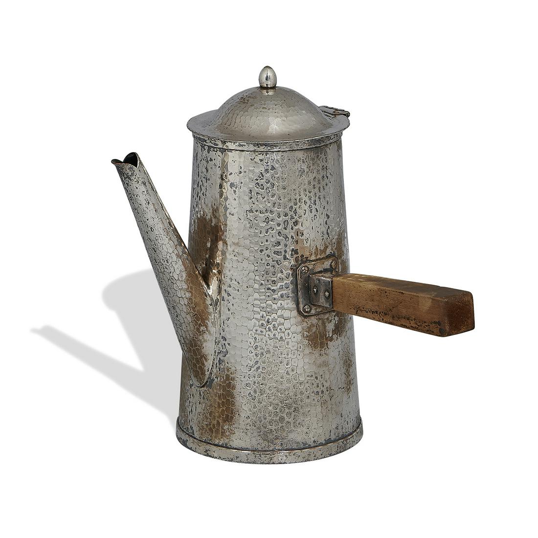 The Roycrofters coffee pot: The Roycrofters coffee pot East Aurora, New York silver wash over copper, mahogany stamped orb and cross overall: 9 1/2"w x 7"d x 9 1/2"h Provenance: The Estates of Vera Parry and Judith Parry Gregori