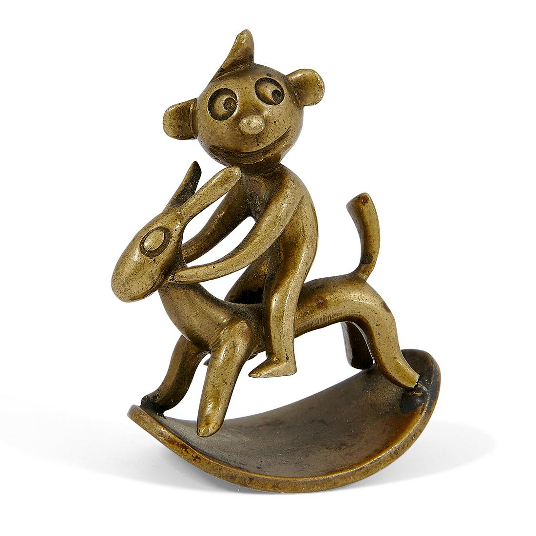 Carl Hagenauer Monkey Riding a Rocking Rabbit: Carl Hagenauer (1872-1928) for Werkstätte Hagenauer Monkey Riding a Rocking Rabbit Vienna, Austria, circa 1925 brass stamped marks 1 5/8"w x 1"d x 2"h