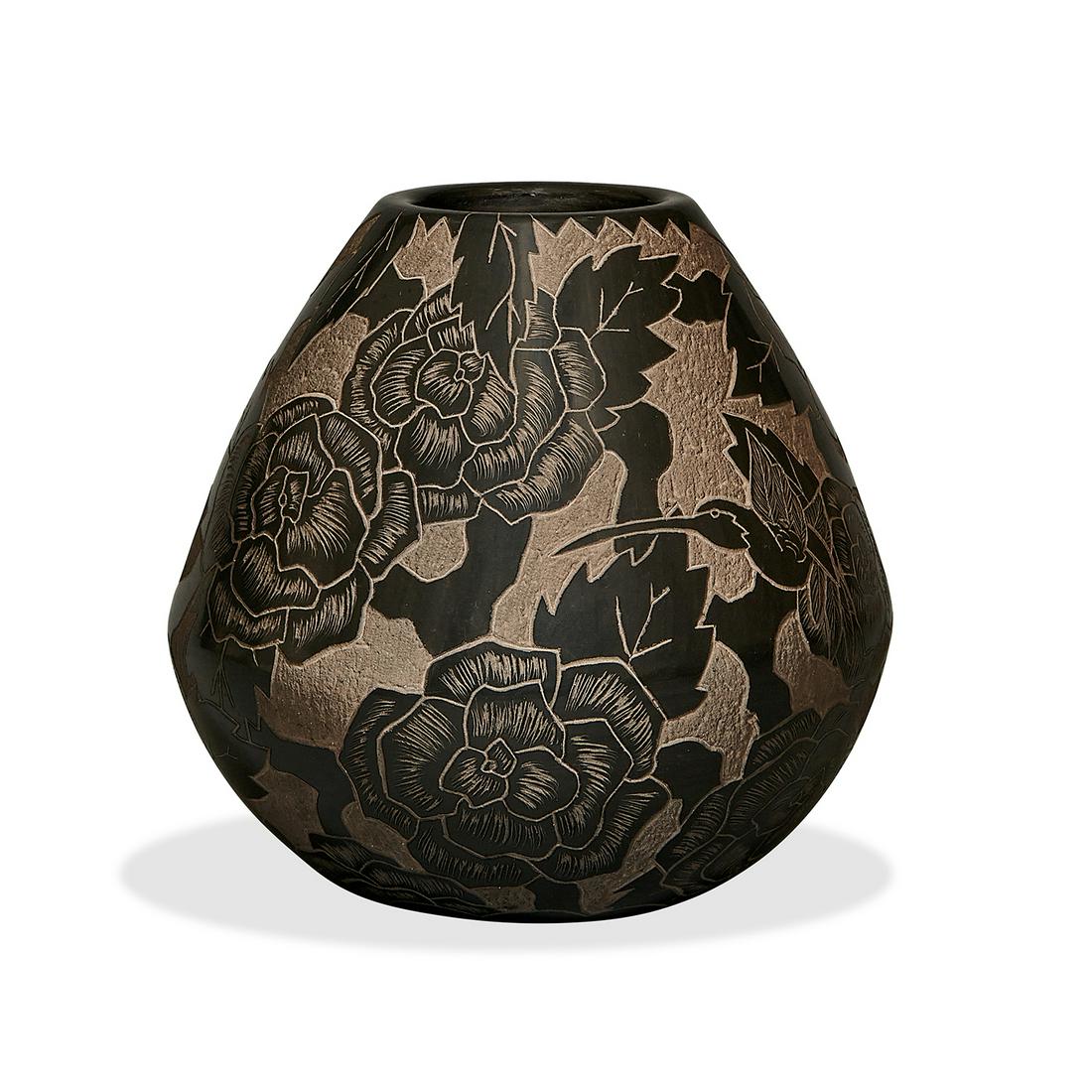 Gwen Tafoya (b. 1965) / Santa Clara Pueblo vase: Gwen Tafoya (b. 1965) / Santa Clara Pueblo vase decorated with a hummingbird and flowers Santa Clara Pueblo, New Mexico sgraffito and carved blackware ceramic incised signature 6 1/2"dia x 6 1/2"h