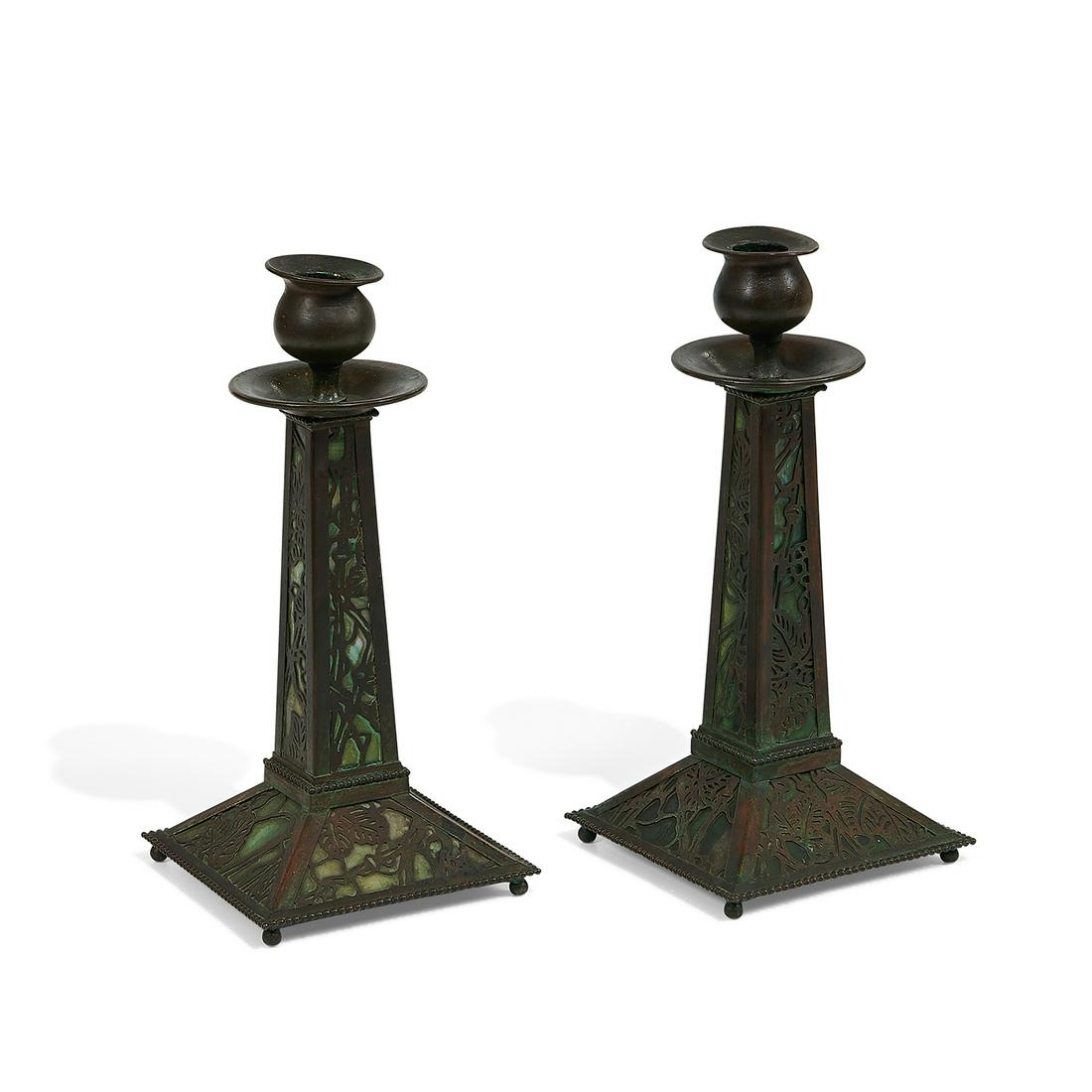 Riviere Studios candleholders, pair: Riviere Studios candleholders, pair with overlay New York, New York bronze, green slag glass one with illegible etched signature each: 4 3/4"sq x 10 1/8"h