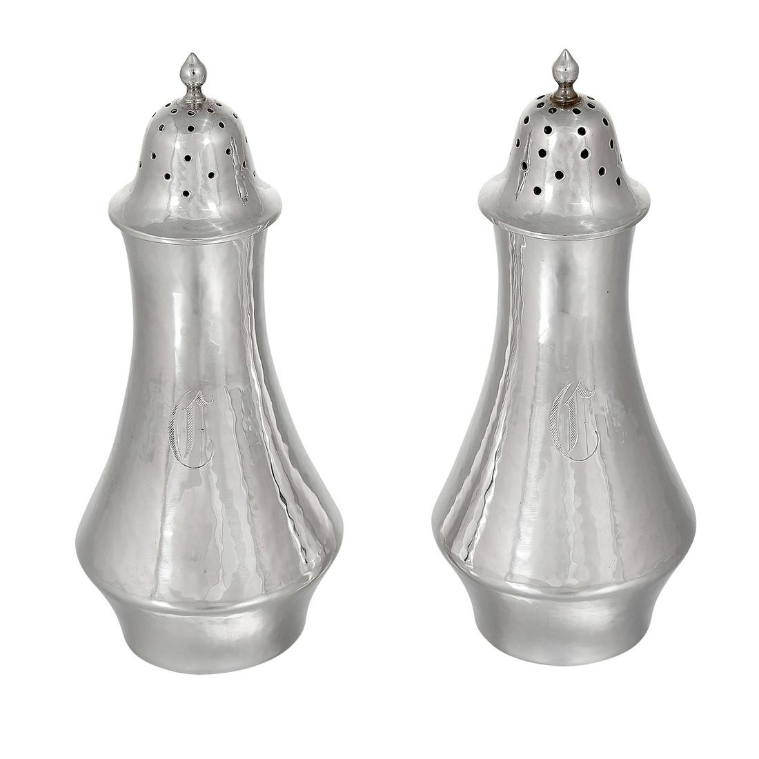 The Kalo Shop casters, pair, #1P: The Kalo Shop casters, pair, #1P Chicago, Illinois sterling silver stamped marks engraved gothic C monograms 2"dia x 4 1/2"h Provenance: The Paul & Terry Somerson Collection of 20th and 21st Century M