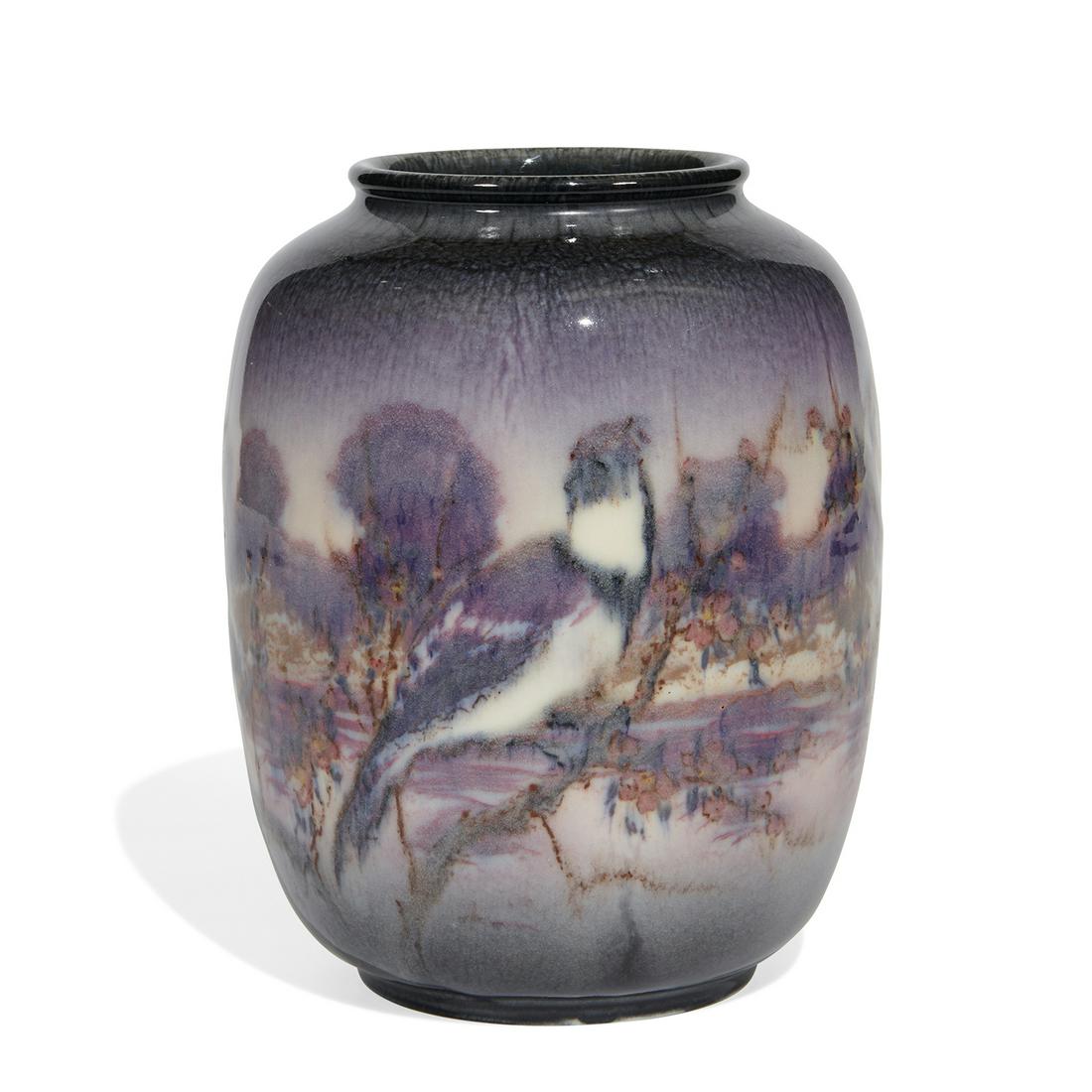 E.T. Hurley, Rookwood Pottery porcelain vase: E.T. Hurley (1869-1950) for Rookwood Pottery porcelain vase with a colorful scene of songbirds perched on cherry branches fronting a woodland vista, shape number 6197C Cincinnati, Ohio, 1945 high glaz