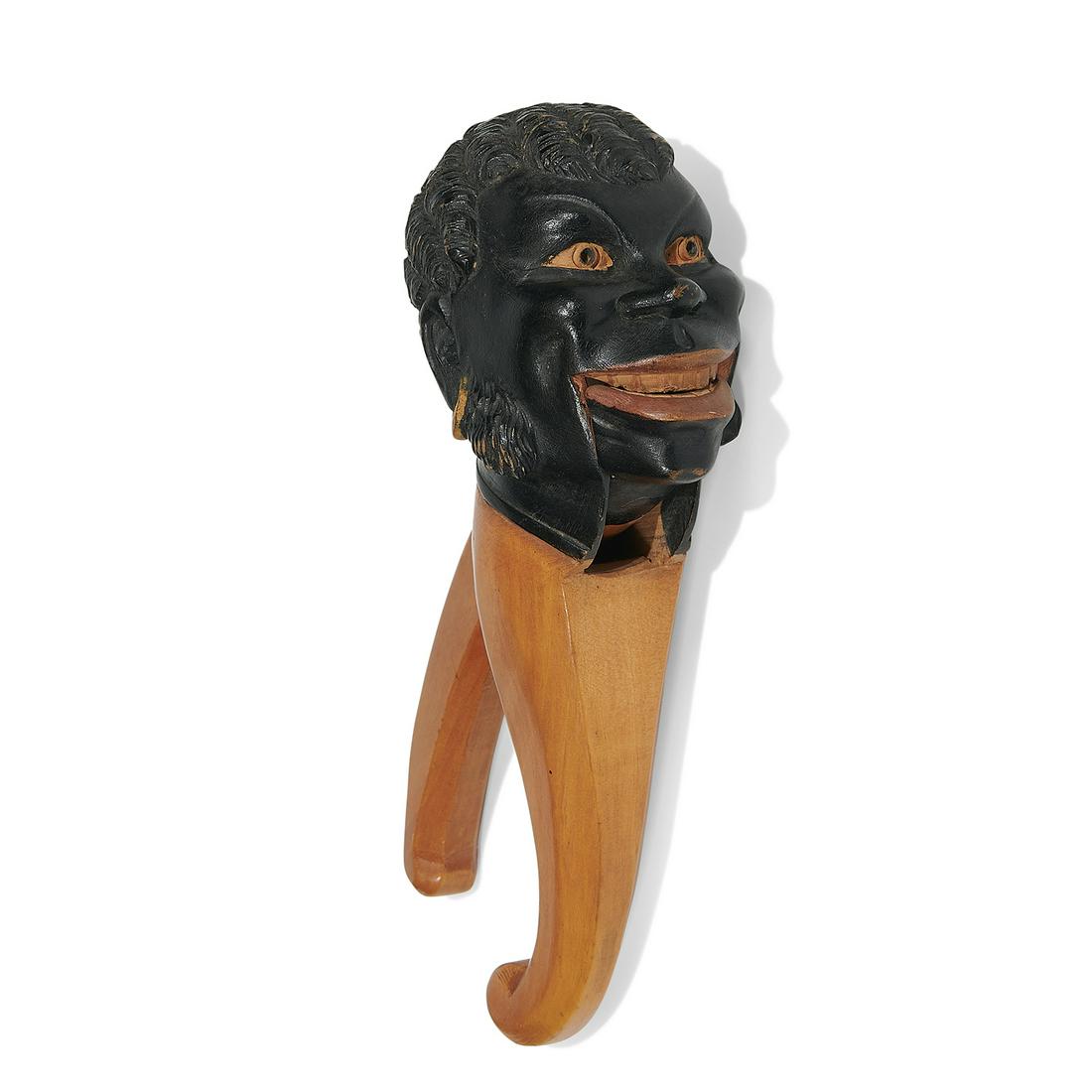 Folk Art Black-Americana figural nutcracker: American Folk Art Black-Americana figural nutcracker USA carved, painted and stained maple 2 1/4"w x 3 1/2"d x 8"h Provenance: Property from the Collection of Governor Jim Thompson, Chicago, Illinois