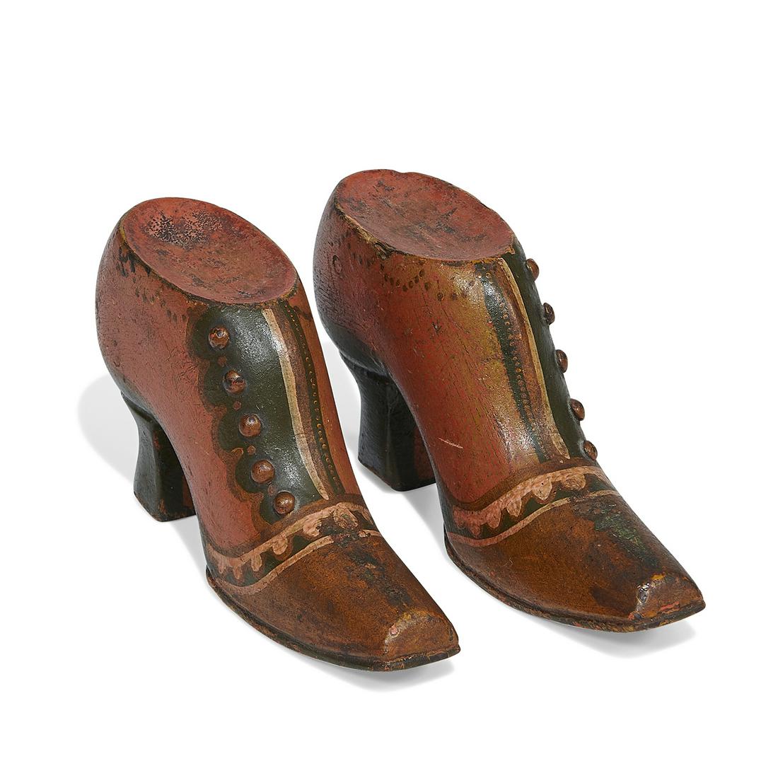 American Folk Art carved heeled shoes, pair: American Folk Art carved heeled shoes, pair USA, circa 1900 carved and polychrome painted wood initialed on one sole T.F. larger: 1 3/4"w x 6 1/4"d x 3 1/2"h
