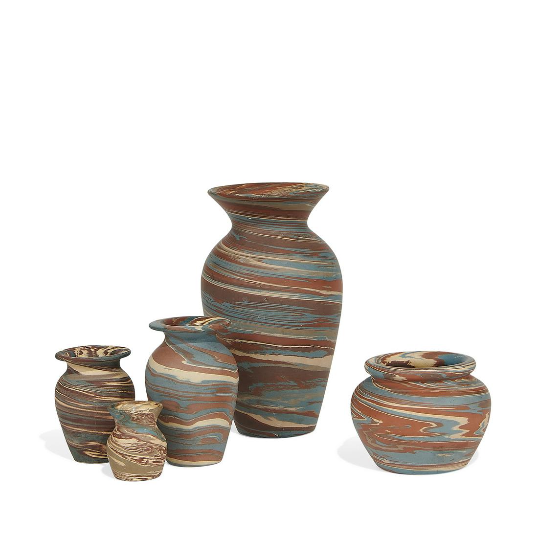 Niloak group of Mission Swirl vases, five: Niloak group of Mission Swirl vases in blue, red and cream clay, five Benton, Arkansas unglazed stoneware four with impressed factory marks, one with partial retail label, the smallest example unmarke