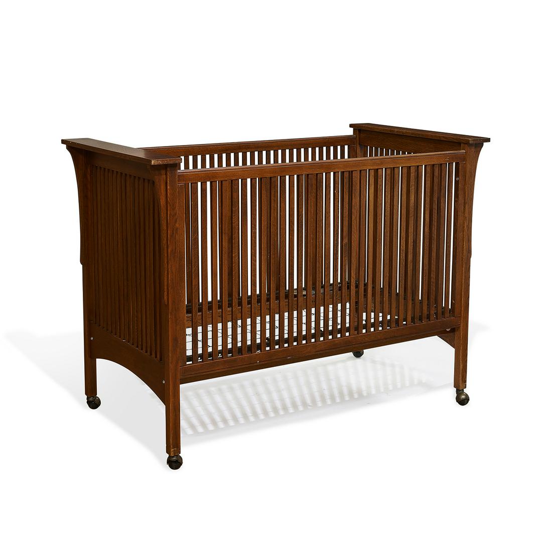 Stickley-Audi baby crib: Stickley-Audi baby crib Fayetteville, New York oak marked 60"w x 32"d x 44"h (including wheels)