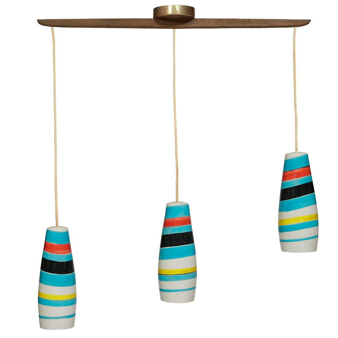 Raymor pendant lamps: Raymor pendant lamps, three Italy, 1960s glazed ceramic, walnut marked 'made in Italy' pendant (each): 5"dia x 12 1/2"h; overall: 35"w x 5"d x 39"h