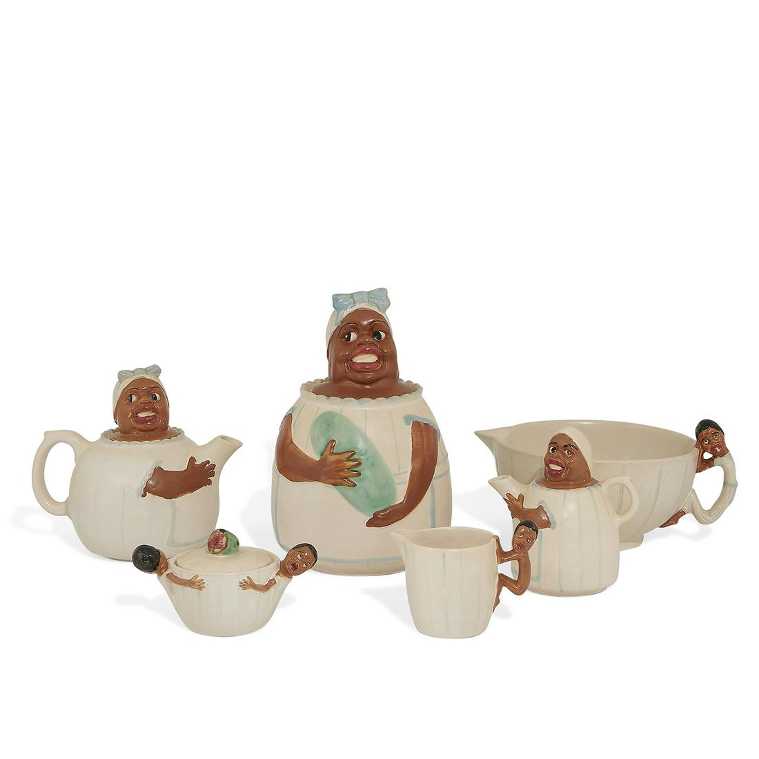 Weller Pottery Co. rare set of Mammy kitchenware: Weller Pottery Co. rare set of earthenware Mammy kitchenware, six: cookie jar with lid, teapot with lid, mixing bowl, sugar bowl with lid, creamer and syrup pitcher Zanesville, Ohio, circa 1925 matte 