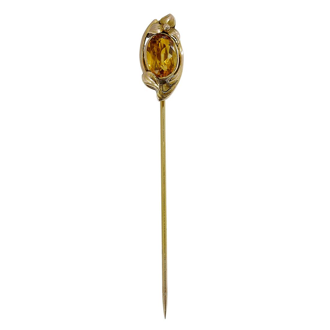 The Kalo Shop, stick pin face: The Kalo Shop stick pin with trilium flower decoration Chicago, Illinois 14K yellow gold, citrine stamped marks 1.9 dwts face: 5/16"w x 11/16"h; 2 3/4"l Provenance: The Paul & Terry Somerson Collectio
