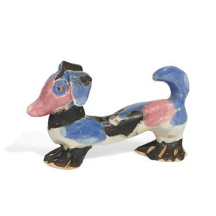 Overbeck Pottery figure of dachshund: Overbeck Pottery grotesque earthenware figure of a dachshund Cambridge City, Indiana, circa 1940 matte and high glazed ceramic incised OBK logo on rear feet 3 5/8"w x 1 1/8"d x 2 1/8"h Provenance: The