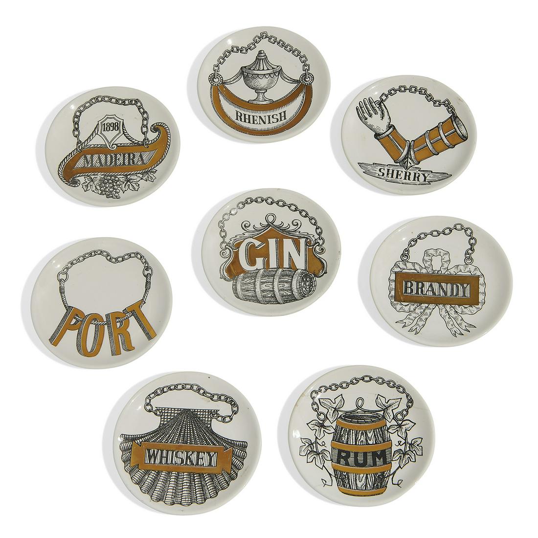 Piero Fornasetti Vini e Liquori coasters, eight: Piero Fornasetti (1913-1988) for Fornasetti Milano Vini e Liquori (Wine & Liquor) coasters, set of eight Milan, Italy, circa 1960 lithographically decorated and gilt porcelain each marked 'Vini e Liqu