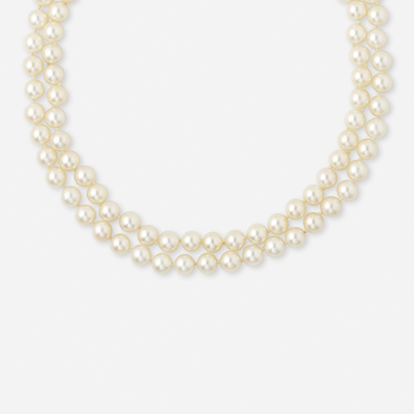 Cultured pearl, diamond, and white gold necklace: Cultured pearl, diamond, and white gold necklace This lot is sold to benefit Village Health Works. The double strand of 49 and 46 cultured pearls, measuring approx. 7.4 mm, with a single-cut diamond c