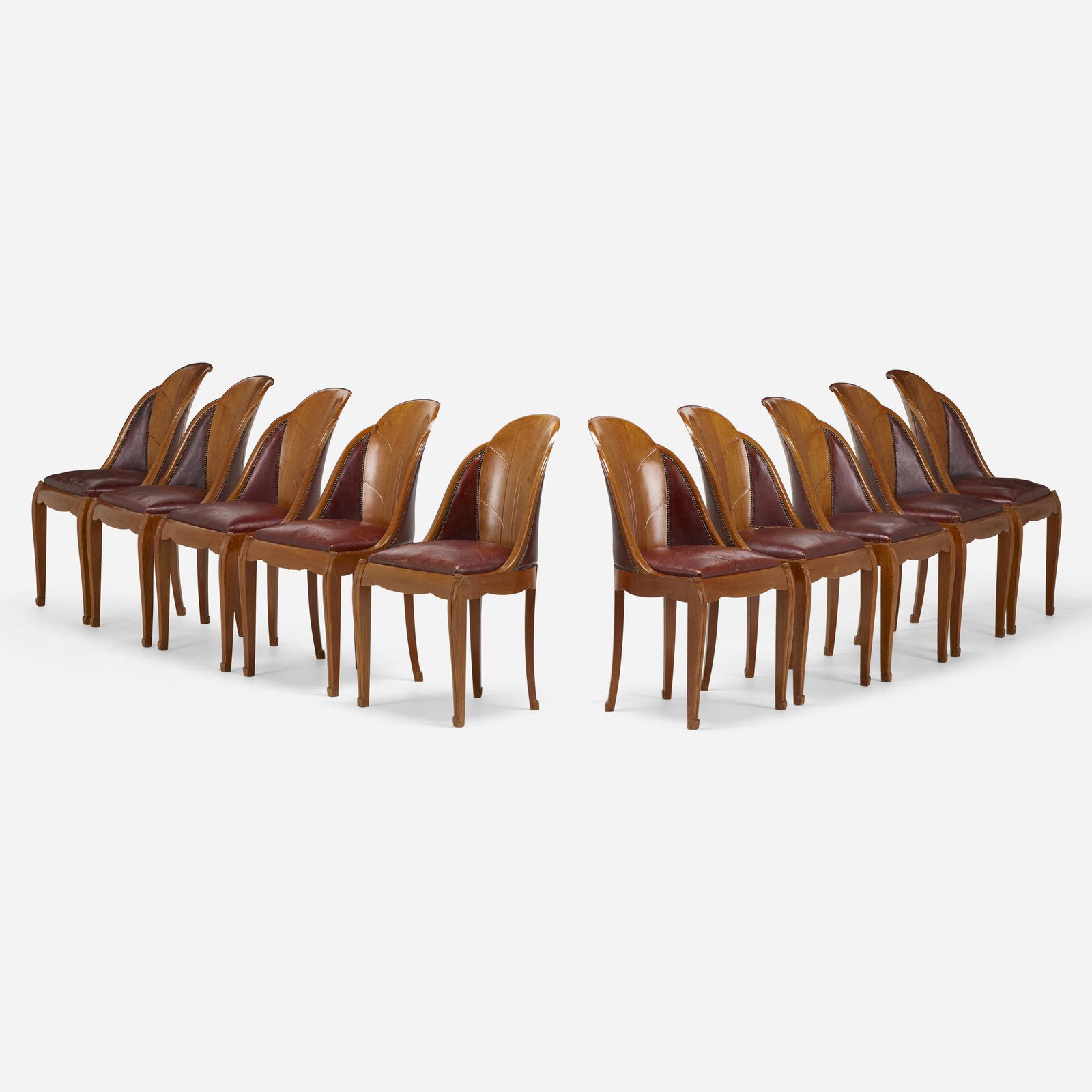 Louis Sue and Andre Mare, Chairs, set of ten: Louis Sue and Andre Mare Chairs, set of ten France, c. 1925mahogany, leather 34 h x 19.5 w x 19 d in (86 x 50 x 48 cm) Branded manufacturer's cypher to underside of each example. Carved to und
