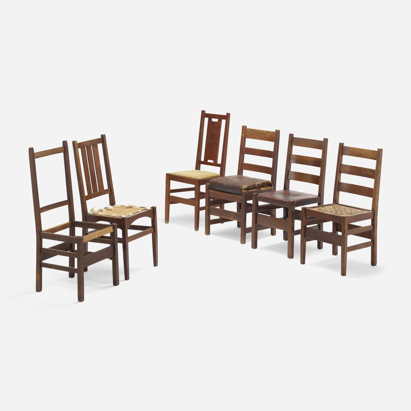 Gustav Stickley, L. & J.G. Stickley, Six chairs: Gustav Stickley and L. & J.G. Stickley Collection of six side chairs USA, 1904-1918oak, upholstery, leather, cane largest: 41.25 h x 16.5 w x 18 d in (105 x 42 x 46 cm) smallest: 36 h x 17 w x 20