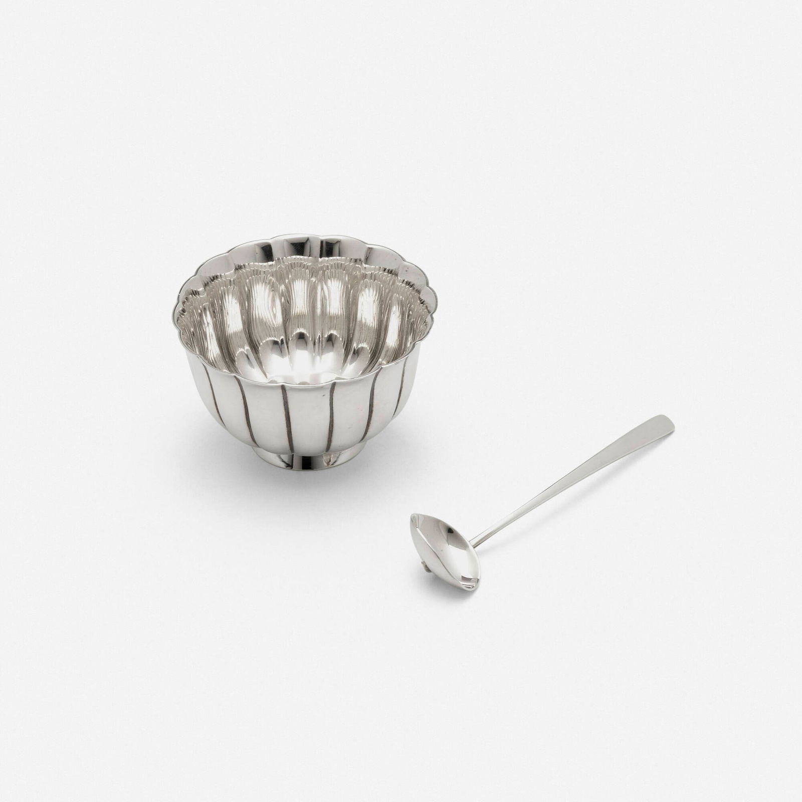 Bulgari, Salt cellar and spoon: Bulgari Salt cellar and spoon Italy, c. 1980sterling silver salt cellar: 1.5 h x 2.5 dia in (4 x 6 cm) spoon: 3.5 h x .875 w x .5 d in (9 x 2 x 1 cm) Impressed manufacturer's mark to unders