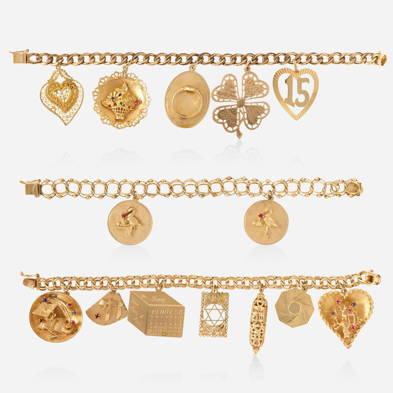 Three gold charm bracelets: Three gold charm bracelets Comprising a bracelet with seven charms; a bracelet with five charms; and a bracelet with two charms 14k and 10k yellow gold 7.25 in, 7.75 in, 7 in; Gross weight 70.2 dwts T