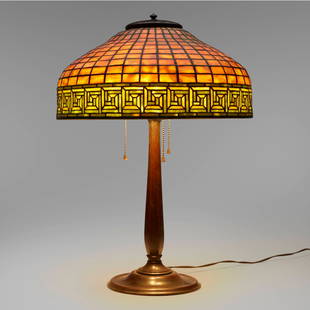 Tiffany Studios, Greek Key table lamp: Tiffany Studios Greek Key table lamp USA, c. 1910leaded glass, patinated bronze 22.25 h x 16 dia in (57 x 41 cm) Lamp features a Colonial Library Standard base.Impressed to shade 'TIFFA