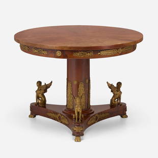 French Empire Style, Gueridon table: French Empire Style Gueridon table 19th century mahogany, brass, ormolu 30 h x 42 dia in (76 x 107 cm) Table features Egyptian Revival motifs. This work will ship from Lambertville, New Jersey.