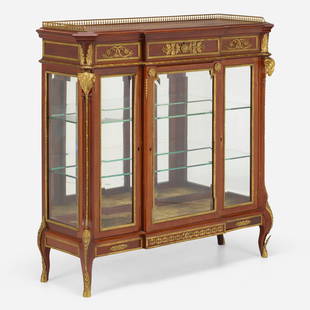 Louis XVI Style, Vitrine: Louis XVI Style Vitrine France, late 19th century mahogany, glass, brass, ormolu, velvet, mirrored glass 50 h x 51 w x 16 d in (127 x 130 x 41 cm) Vitrine features three doors concealing two snug