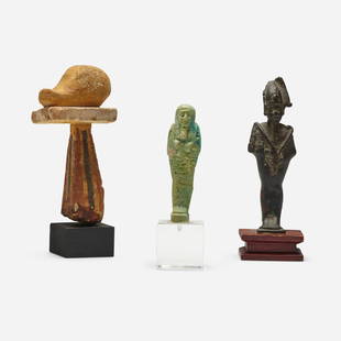 Egyptian, Collection of three Antiquity objects: Egyptian Collection of three Antiquity objects bronze, painted wood, faience 6.75 h x 1.75 w x 2.5 d in (17 x 4 x 6 cm) 6.25 h x 2.125 w x 2.25 d in (16 x 5 x 6 cm) 5.5 h x 1.5 w x 1.5 d in (14 x 4