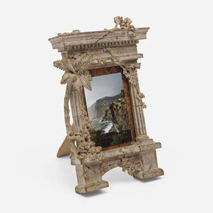 Italian, A Grand Tour picture frame: Italian A Grand Tour picture frame mid-19th century painted wood 13.75 h x 9 w x 9.5 d in (35 x 23 x 24 cm) Frame features architectural ruins motif with foliage including vines and a palm tree.