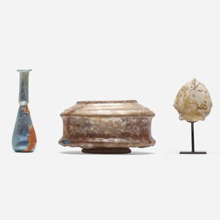 Collection of three Antiquity objects: Various Makers Collection of three Antiquity objects glazed earthenware, glass, stone 2.75 h x 5 w in (7 x 13 cm) 4.25 h x 1.25 w in (11 x 3 cm) 3.5 h x 2 w x 1.375 d in (9 x 5 x 3 cm) Collection