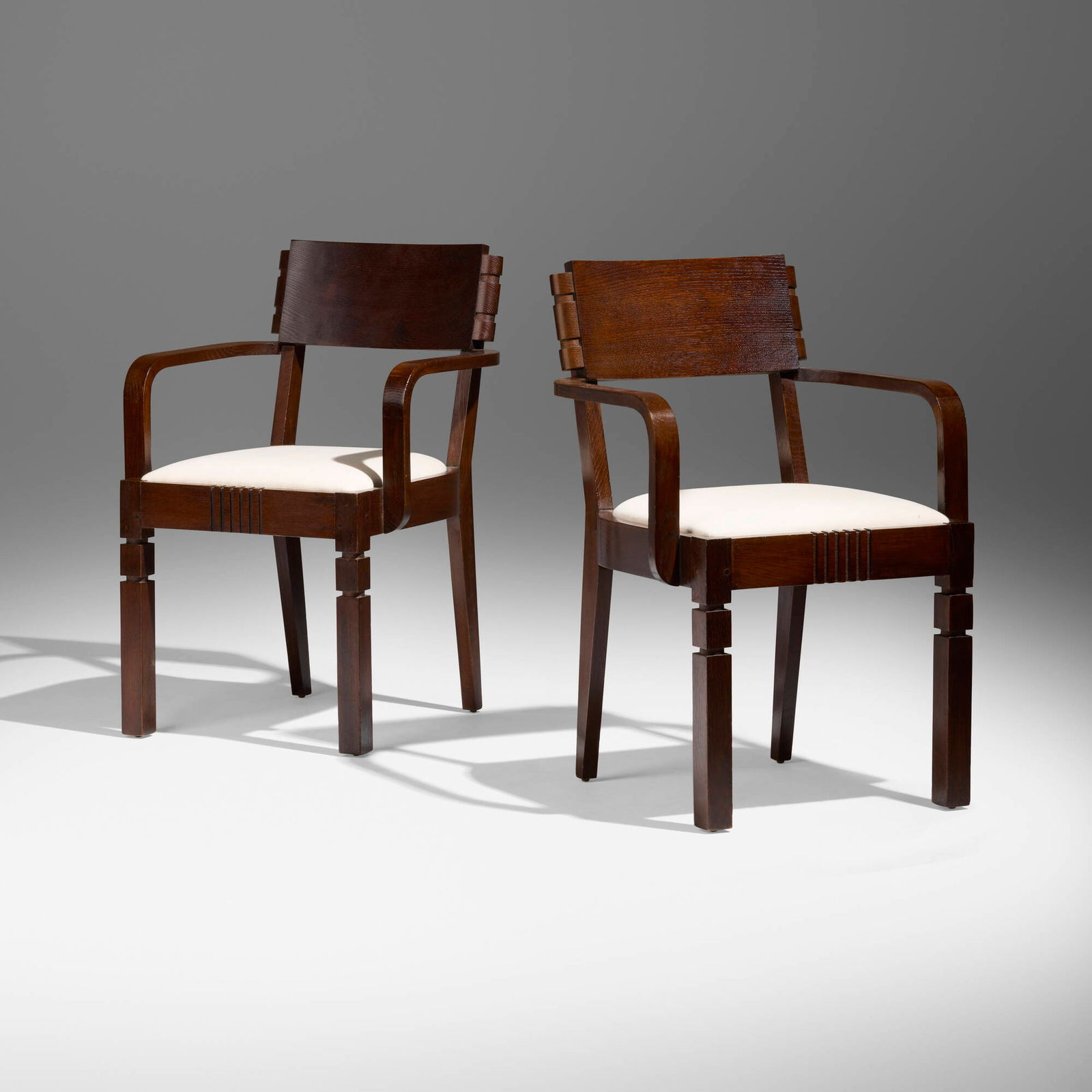 Charles Dudouyt, Armchairs, pair: Charles Dudouyt Armchairs, pair France, c. 1945oak, upholstery 32.75 h x 22 w x 21.5 d in (83 x 56 x 55 cm) Branded artist's cipher to underside of each example. This work