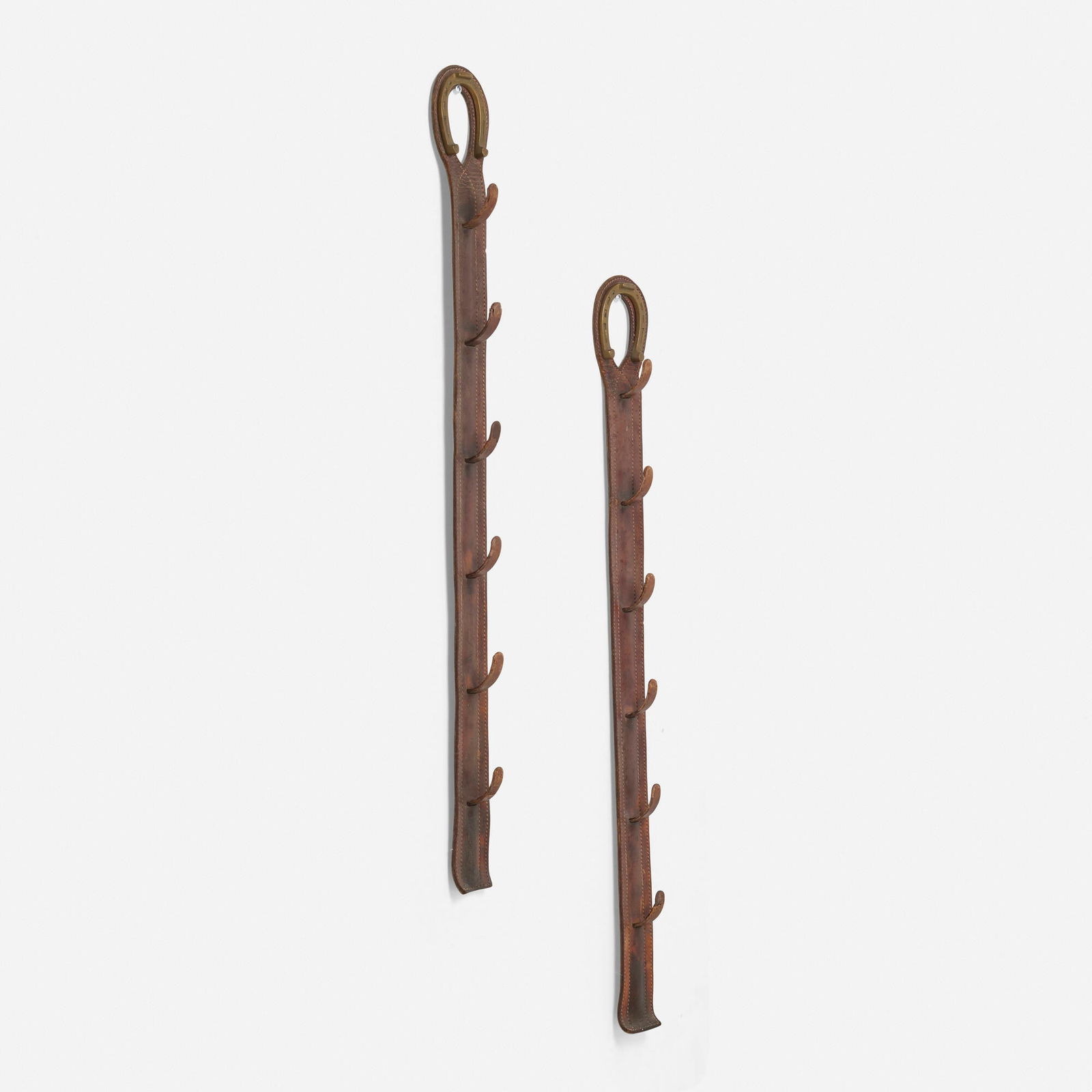 In the manner of Jacques Adnet, Coat racks, pair (1 of 3)