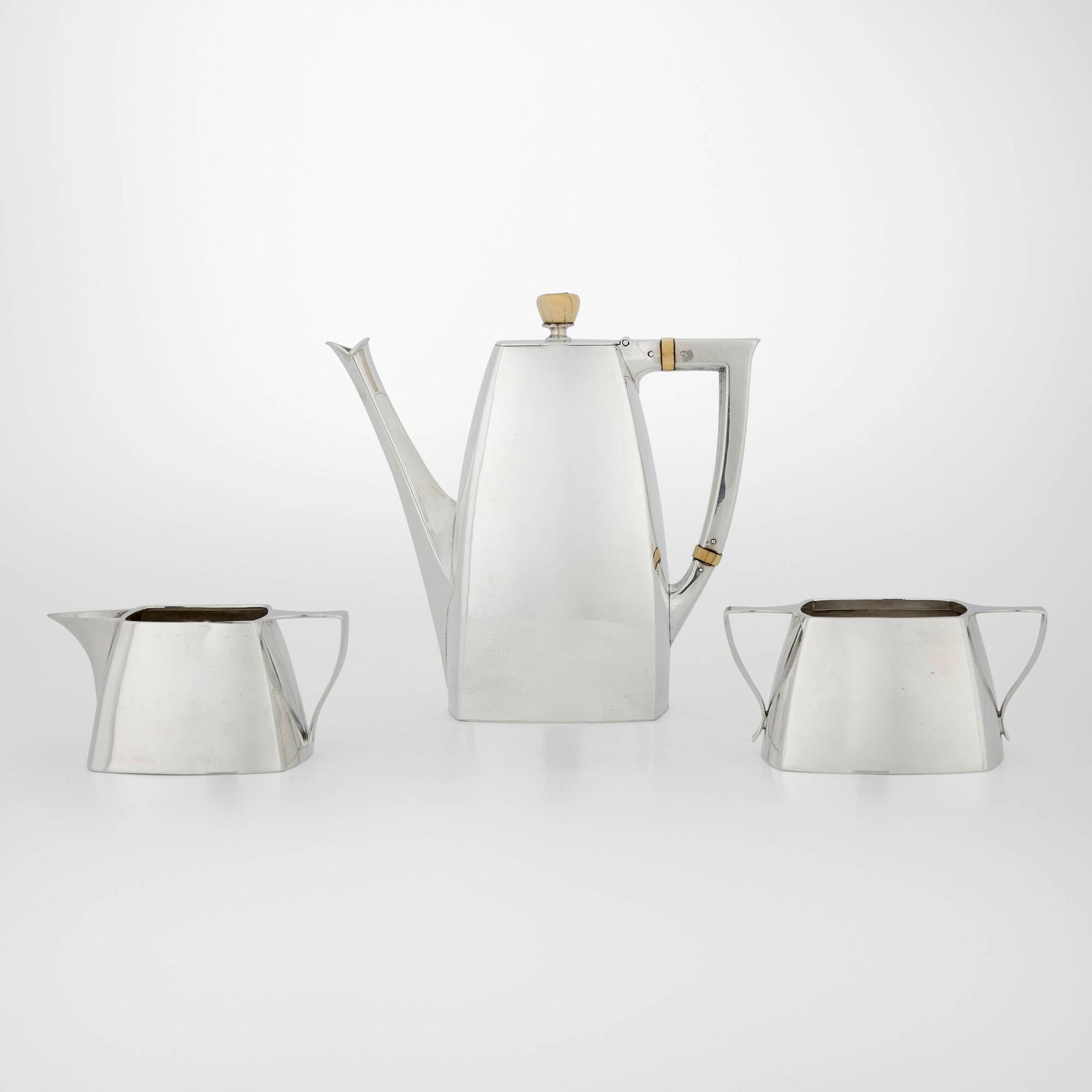 International Silver Company, Three-piece coffee service: International Silver Company Three-piece coffee service Meriden, USA, first half of the 20th centurysterling silver 6.125 h x 2.875 w x 6.375 d in (16 x 7 x 16 cm) 2 h x 4.25 w x 3.125 d in (5 x 1