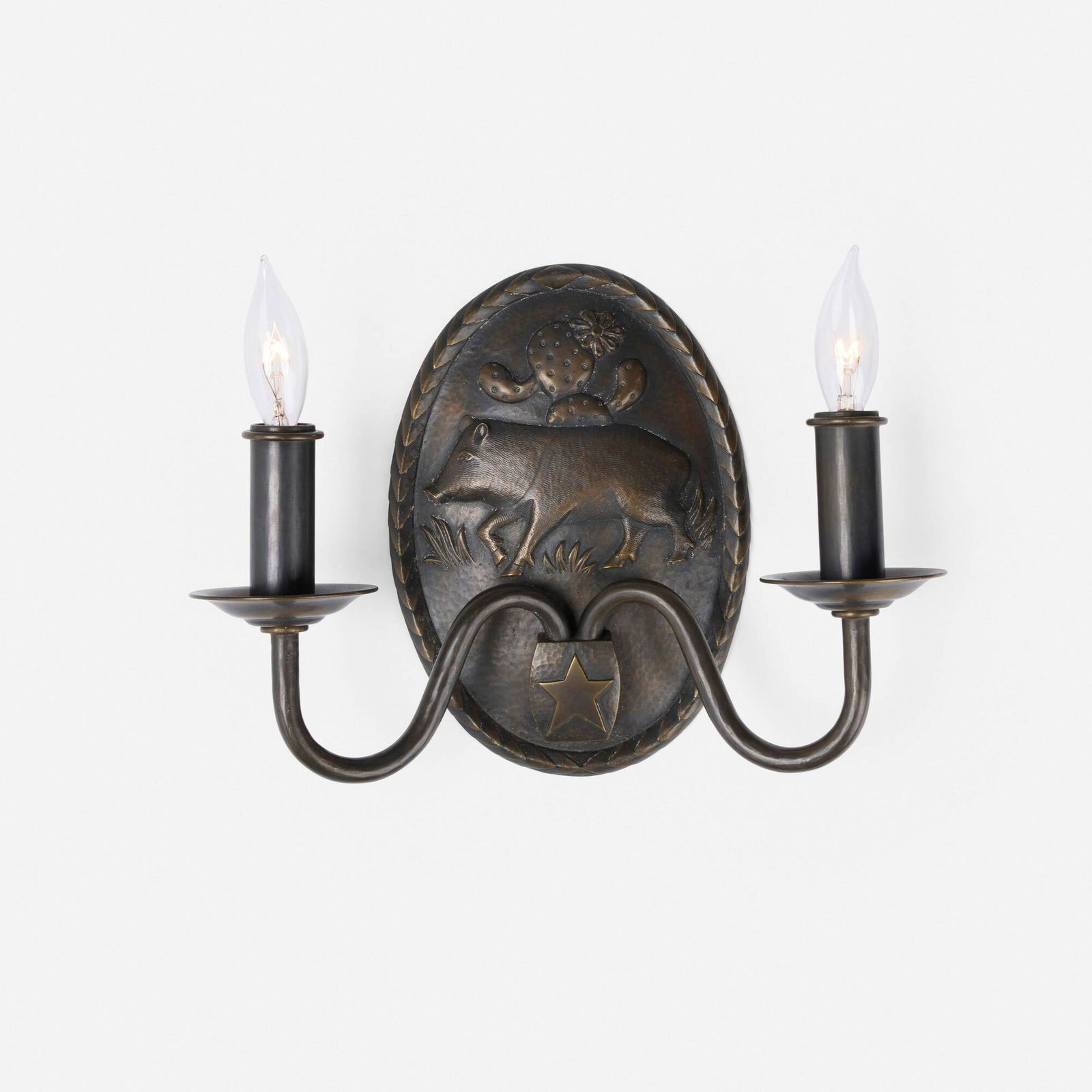 Samuel Yellin Metalworkers, Custom sconce with javelina: Samuel Yellin Metalworkers Custom sconce with javelina USA, 2001bronze 8.5 h x 12 w x 4 d in (22 x 30 x 10 cm) This sconce was custom designed for actor Tommy Lee Jones. Impressed manufacturer