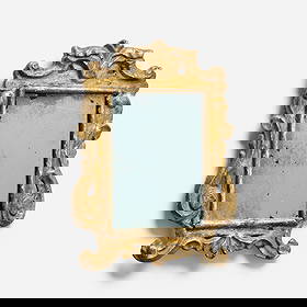 Italian, Baroque wall mirror: Italian Baroque wall mirror 18th centurycarved and gilt wood, mirrored glass 12 h x 9.25 w x 0.75 d in (30 x 23 x 2 cm) Provenance: Property from a Nelson Shanks decorated int