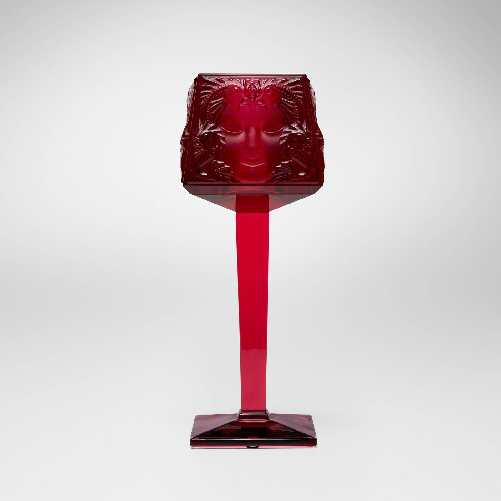 Lalique, Masque de Femme votive candle holder: Lalique Masque de Femme votive candle holder France, late 20th century molded red glass 12 h x 4.5 w x 4.5 d in (30 x 11 x 11 cm) "Masque de Femme" was originally designed by Rene Lalique in 19