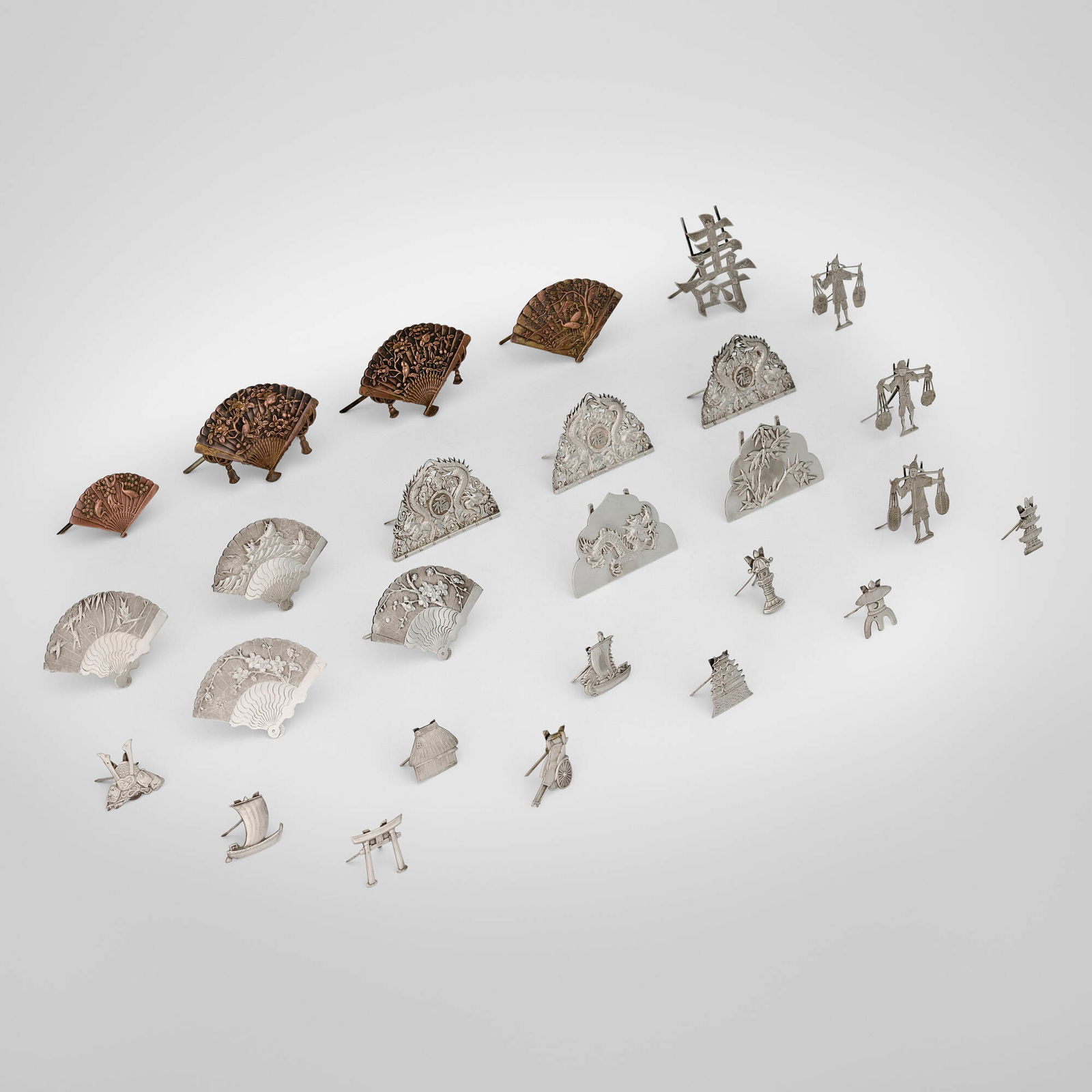 Chinese Export and Japanese, Collection of twenty-seven place card holders: Chinese Export and Japanese Collection of twenty-seven place card holders late 19th-early 20th centurymixed metals, silver largest: 2.25 h x 3.25 w x 1.5 d in (6 x 8 x 4 cm) smallest: 1 h x 1.25 w