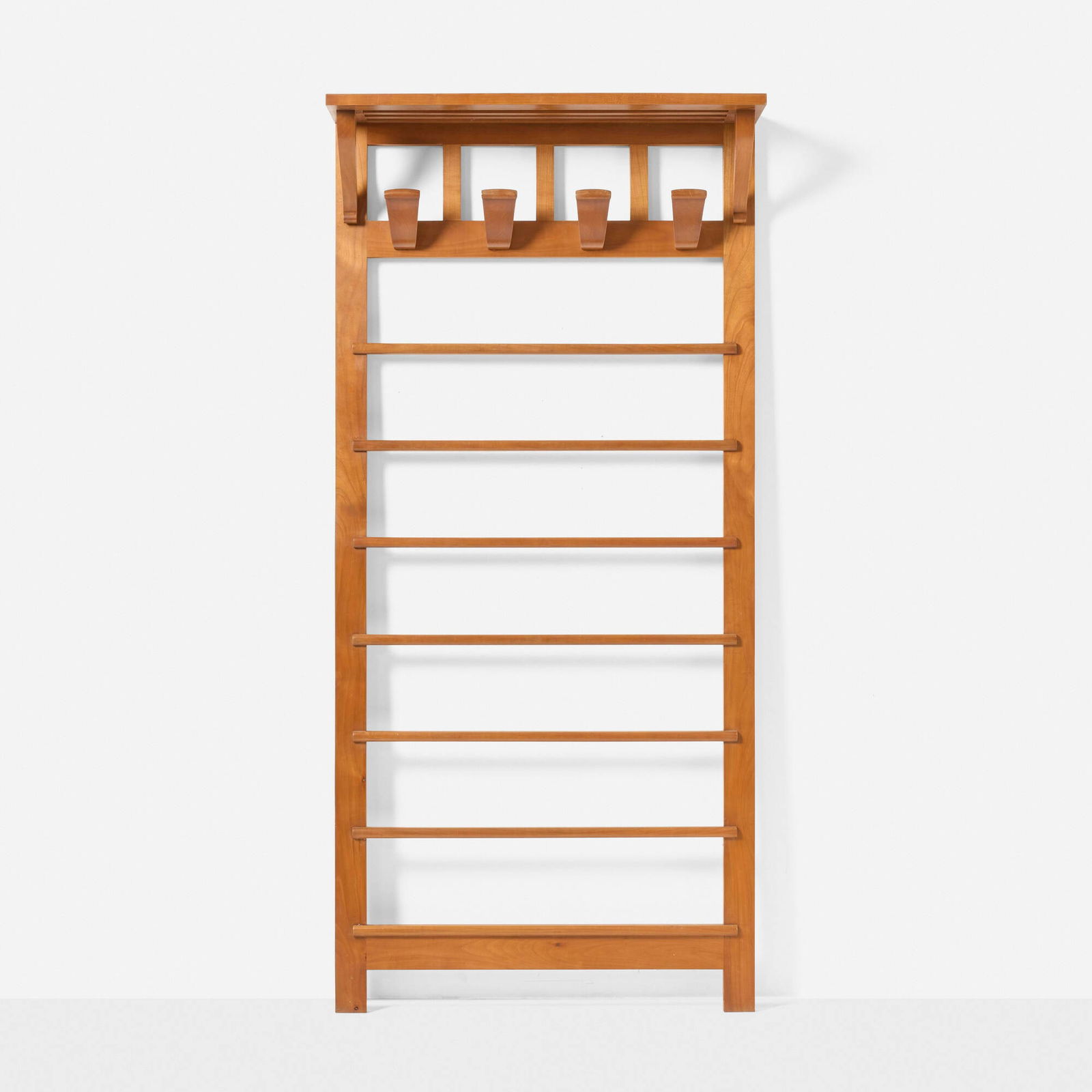 In the manner of Andre Arbus, Coat stand: In the manner of Andre Arbus Coat stand France, c. 1950oak 68 h x 31.5 w x 10 d in (173 x 80 x 25 cm) This work will ship from Los Angeles, California.